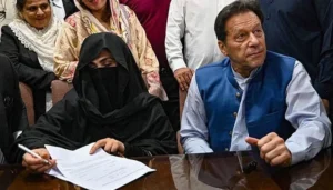 PTI Chairman Imran Khan (right) along with his wife Bushra Bibi